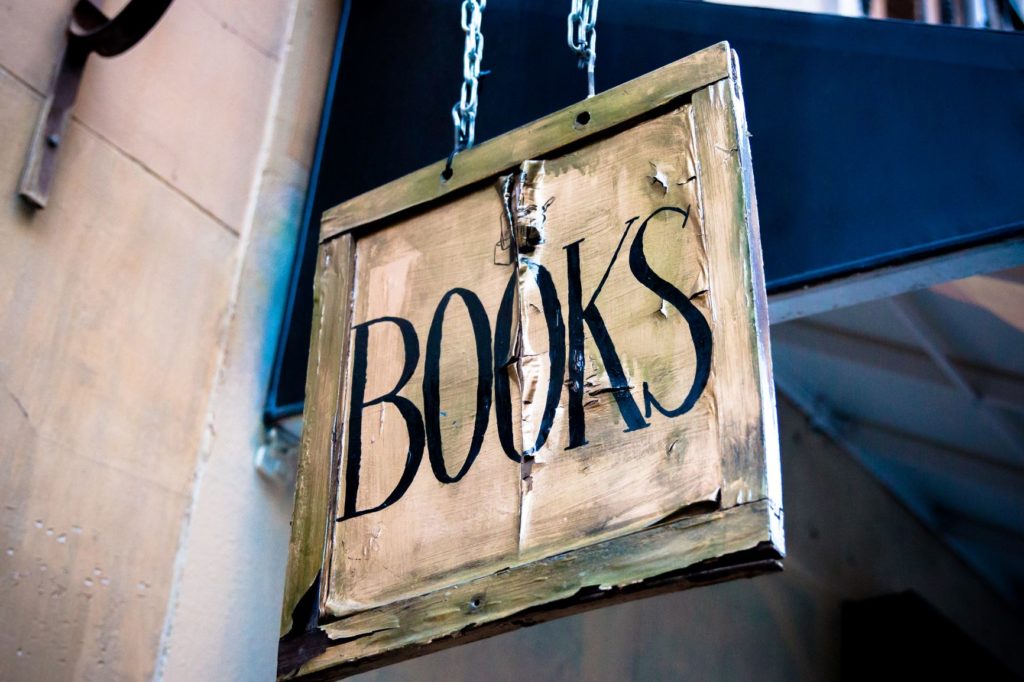 Photo by César Viteri on Unsplash of a bookstore sign
