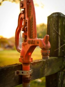 Photo by Frankie Lopez on Unsplash photo of an orange water pump